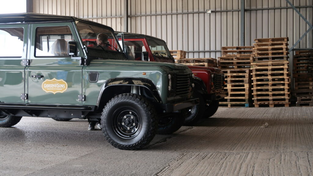 Two luxury custom Land Rovers on arrival at the Autoshippers warehouse