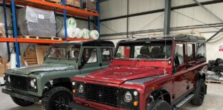 A Land Rover Defender 110 and Land Rover Defender 130 awaiting loading into a 40’ container by Autoshippers for shipping to the USA