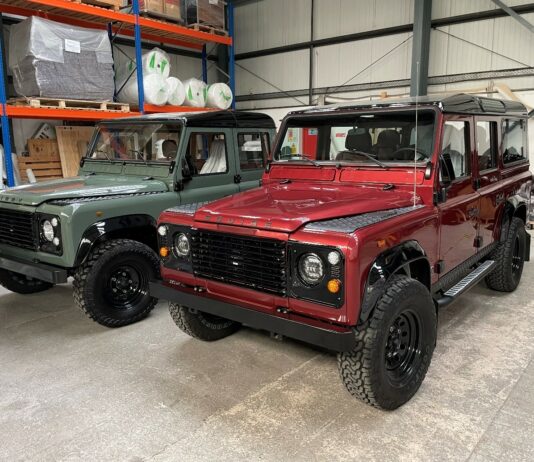 A Land Rover Defender 110 and Land Rover Defender 130 awaiting loading into a 40’ container by Autoshippers for shipping to the USA