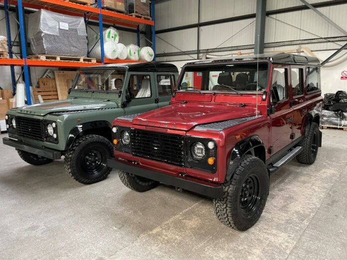 A Land Rover Defender 110 and Land Rover Defender 130 awaiting loading into a 40’ container by Autoshippers for shipping to the USA