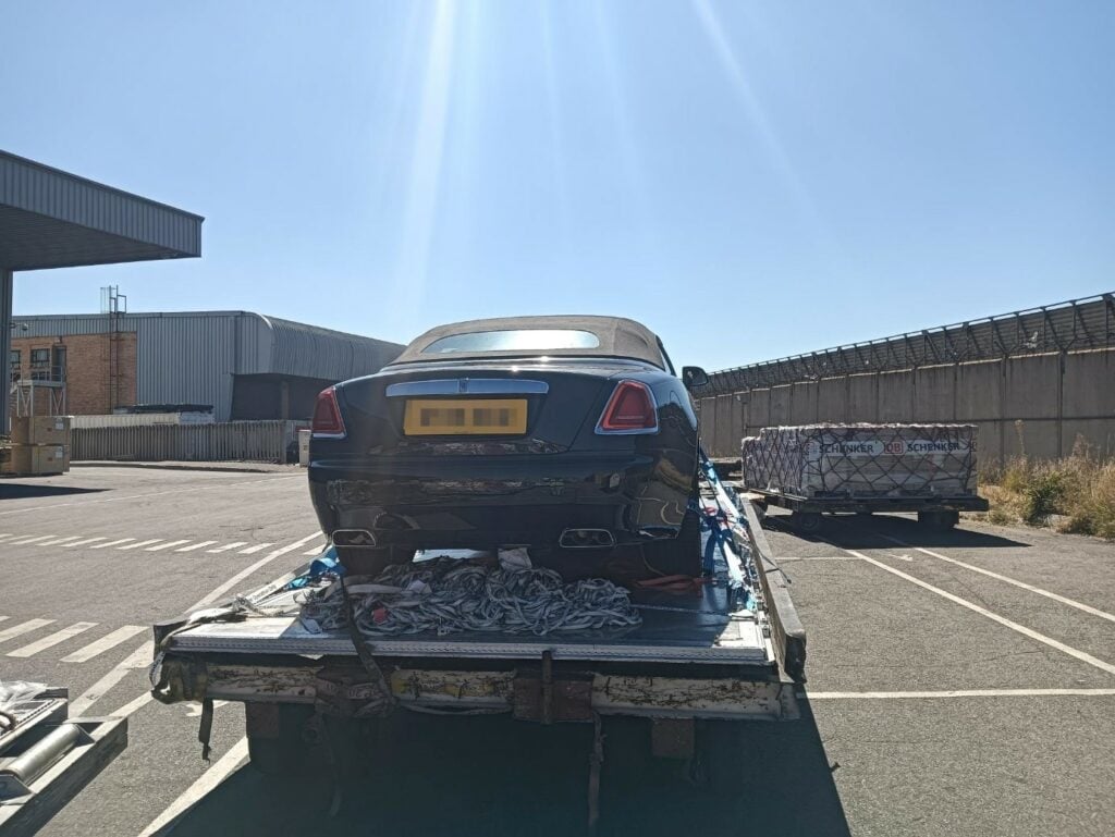 2019 Rolls Royce Dawn in Black and Grey loaded onto an aircraft pallet after arrival at Johannesburg airport after shipping from the UK