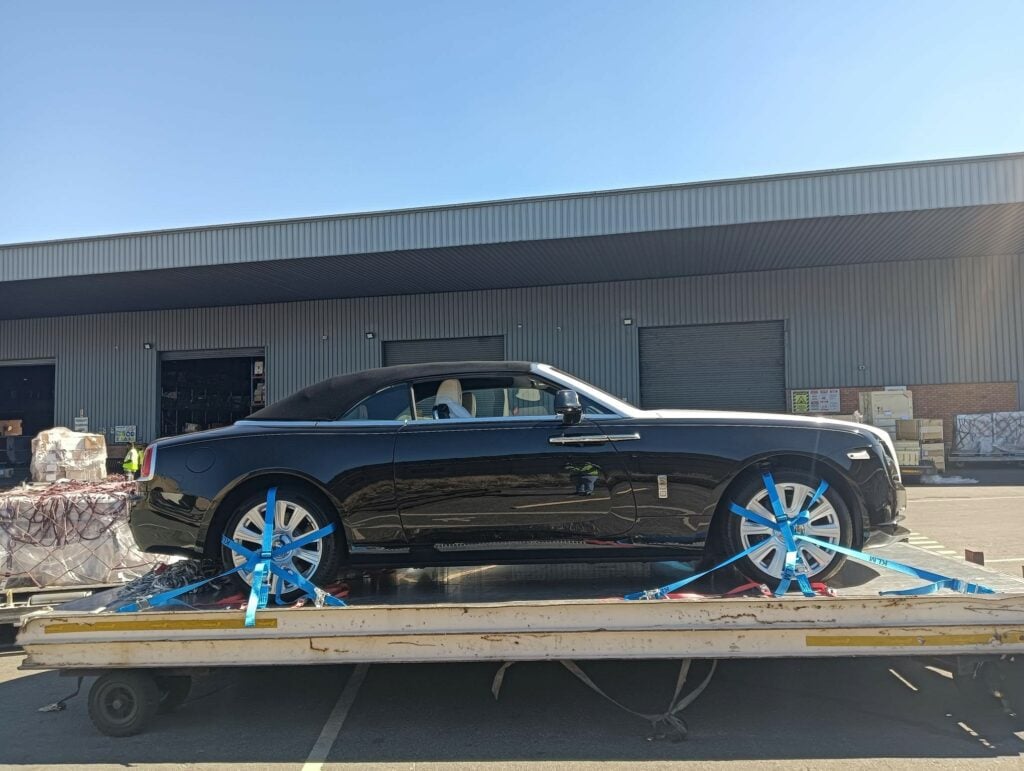 2019 Rolls Royce Dawn in Black and Grey loaded onto an aircraft pallet after arrival at Johannesburg airport after shipping from the UK