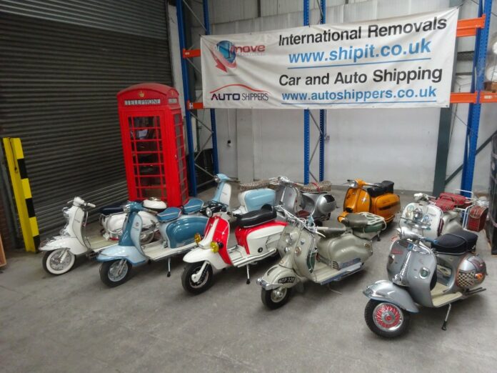 9 Classic Lambretta and Vespa Scooters waiting for packing in their bespoke, made to measure crates at Autoshippers warehouse before shipping to the USA